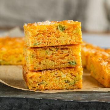 Three squares of savoury carrot slice on top of each other to show the texture.
