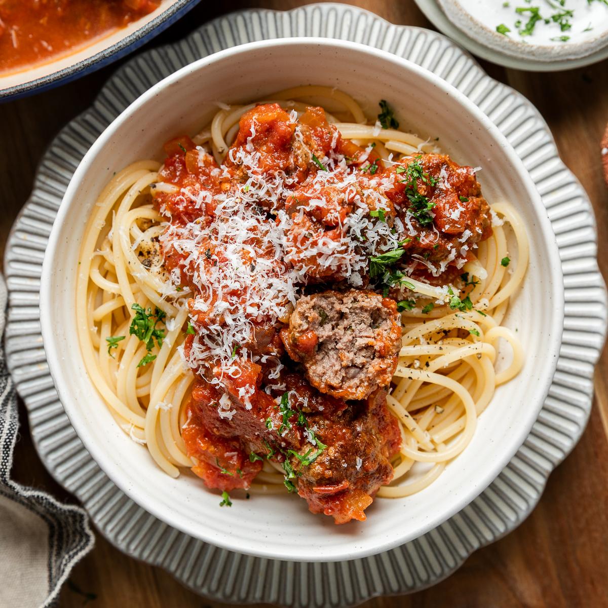 A bowl of gluten-free spaghetti and meatballs.