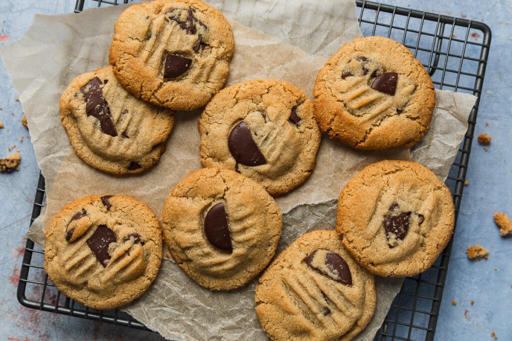 Homemade almond meal chocolate chip cookies on a cooling rack