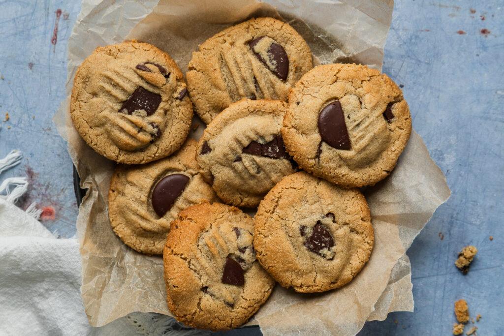 Healthy almond flour chocolate chip cookies in a tin ready to serve.