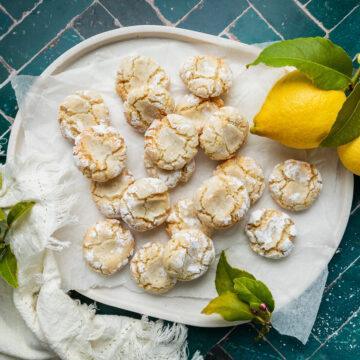 A white tray of homemade gluten-free lemon almond cookies.